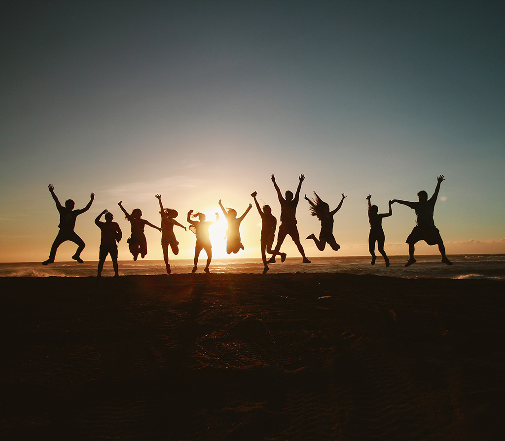 silhouette-photography-of-group-of-people-jumping-during
